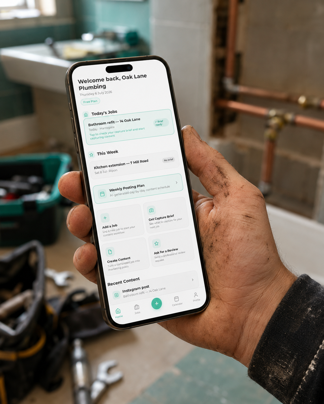 WorkProof app shown on a phone held by a tradesperson on site
